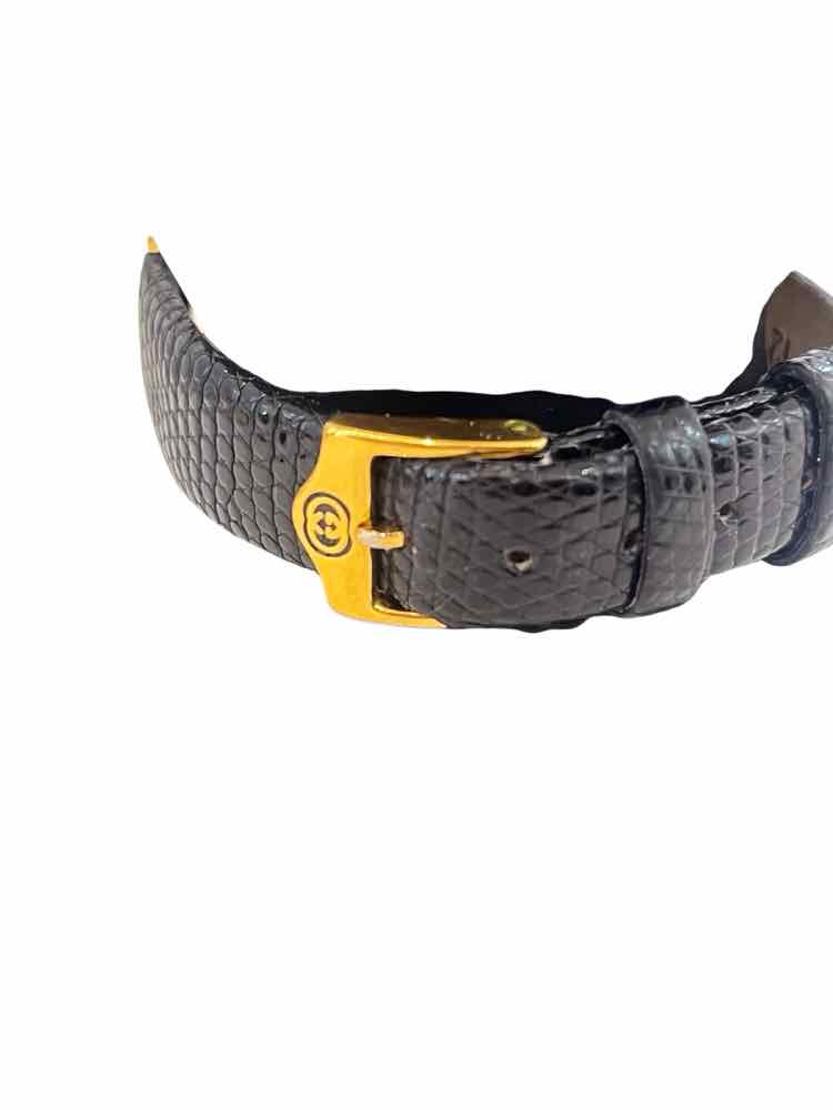 Gucci Black and Gold Watch