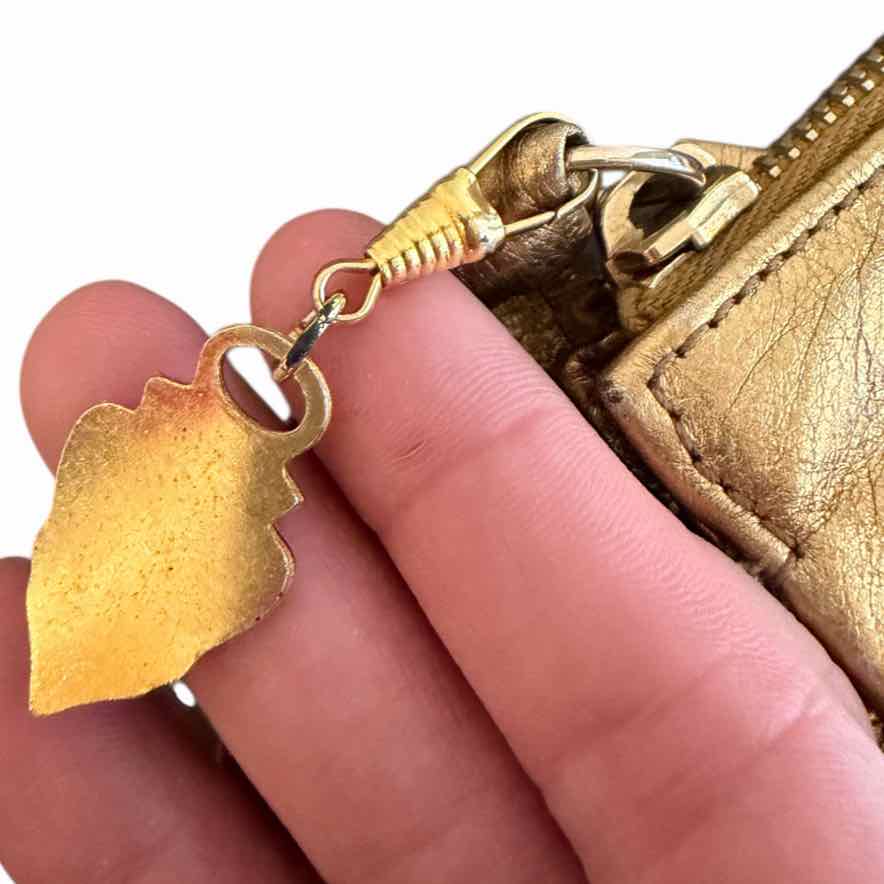 Gucci metallic gold Handbag