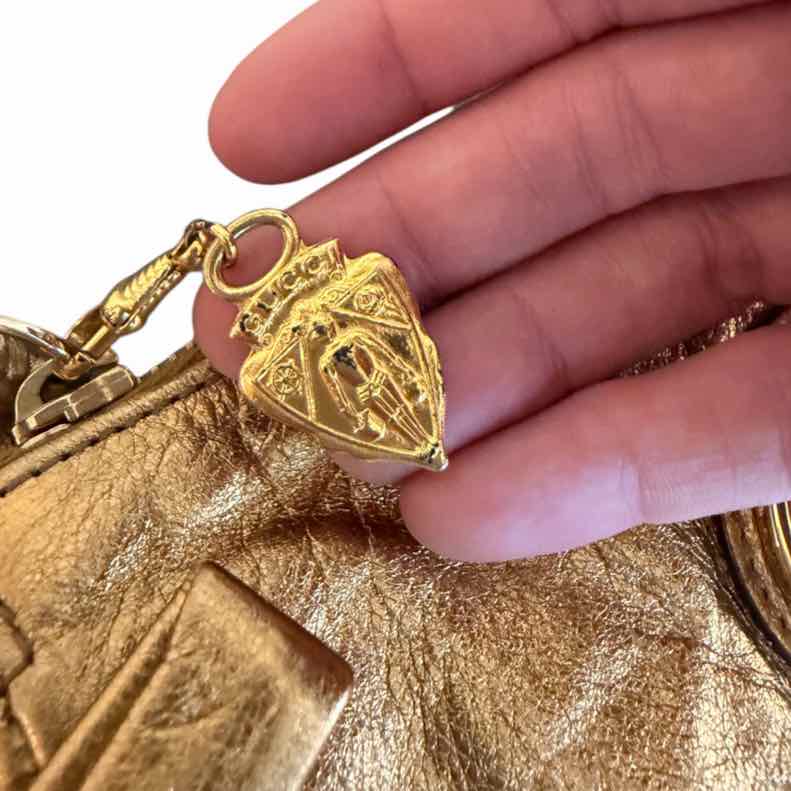 Gucci metallic gold Handbag