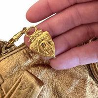 Gucci metallic gold Handbag